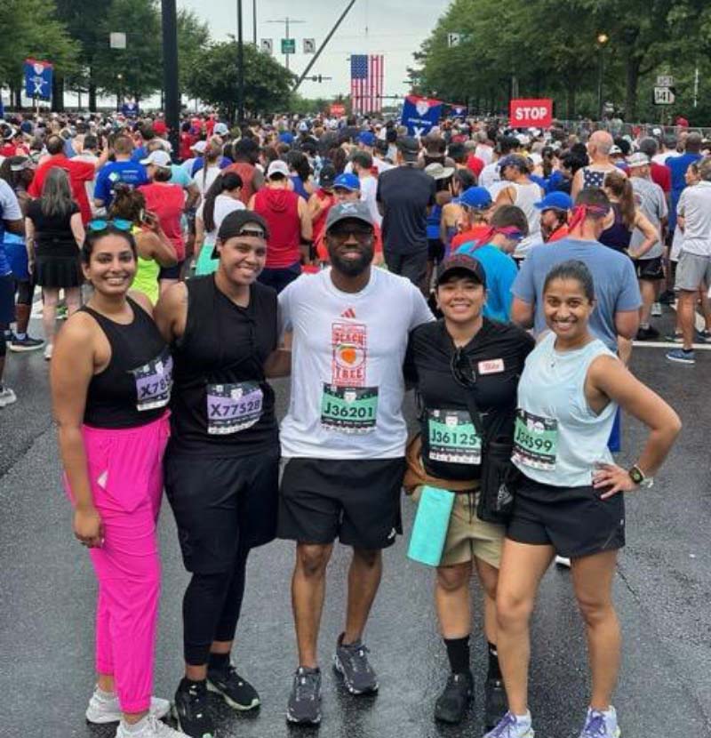 Willie Hatchett at the 2023 Peachtree Road Race with the police officer and physicians who did CPR when his heart stopped during the 2022 race. From left: Dr. Komal Paladugu, Dr. J. Goines, Hatchett, Officer Melina Lim and Dr. Anita Mallya. (Photo courtesy of Willie Hatchett)
