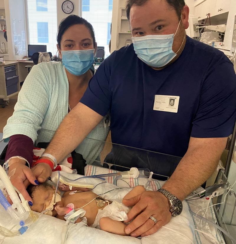 Stephanie (left) and Justin Cervantes with their newborn son, William, in the hospital. (Photo courtesy of the Cervantes family)