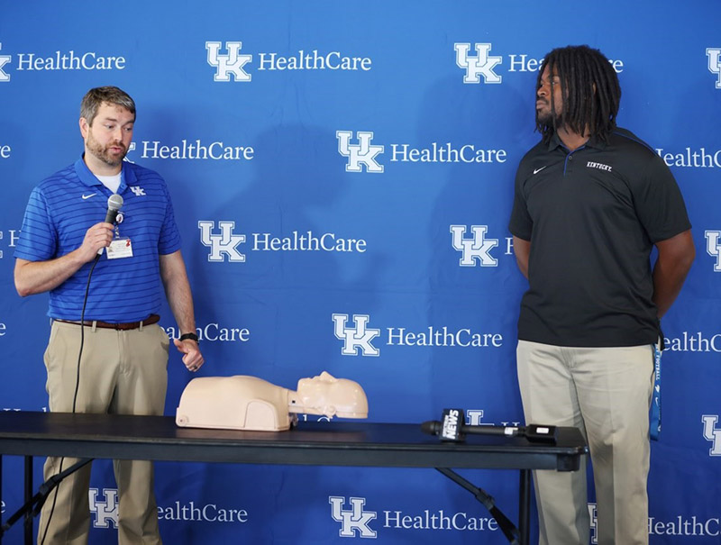Kenneth Horsey (far right) coordinated and planned a hands-only CPR training for the UK football team and staff. (Photo courtesy of University of Kentucky Athletics)