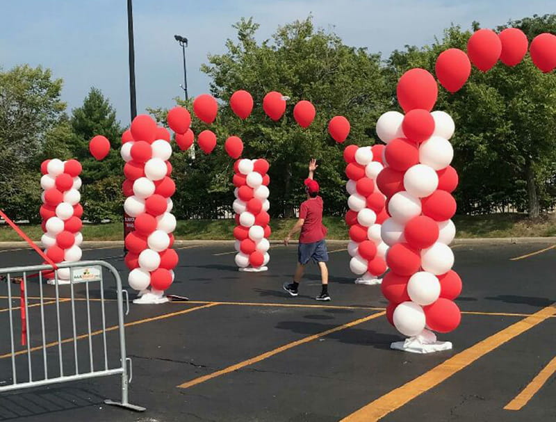 Trent walking through the survivor tunnel at the Chicago Heart Walk. (Photo courtesy of Laura Arnold)