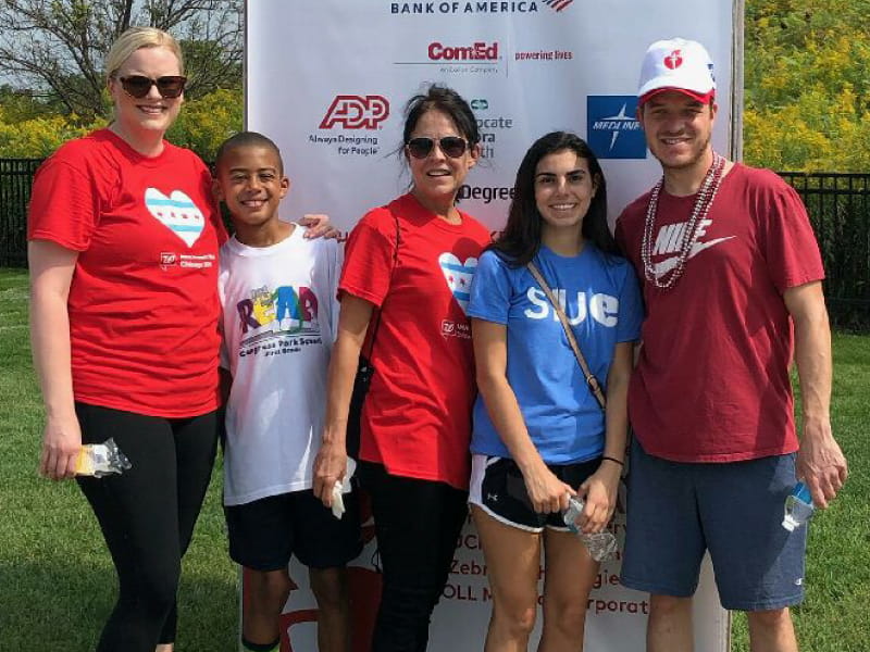 Trent Arnold (right), a heart transplant and stroke survivor, at the finish line of the Chicago Heart Walk with family. (Photo courtesy of Laura Arnold)
