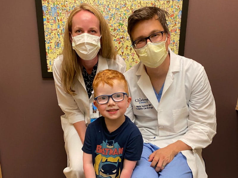 Congenital heart defect survivor Henry Johnson (center) and two of his care providers, Dr. Marko Vezmar (right) and nurse practitioner Jocelyn Berbee. (Photo courtesy of Stephanie Johnson)