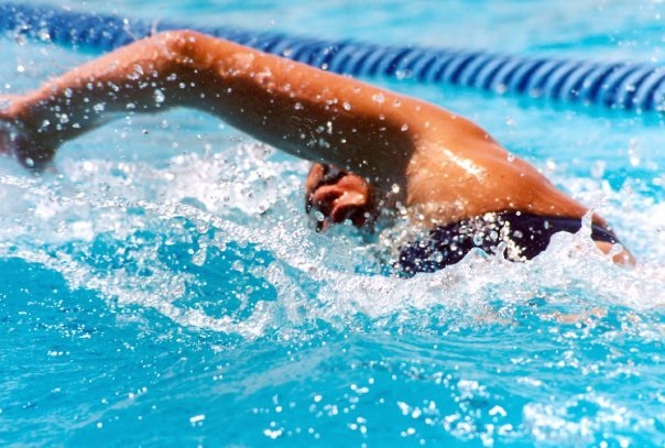 Stroke survivor Tara MacInnes competes for her swim team in May, 2004. (Photo courtesy of Tara MacInnes)