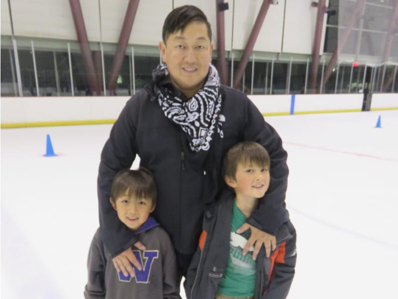 Dave Kim (center) ice skates with sons Brandon Kim (left), and Christian Kim before his stroke. (Photo courtesy of Dave Kim)
