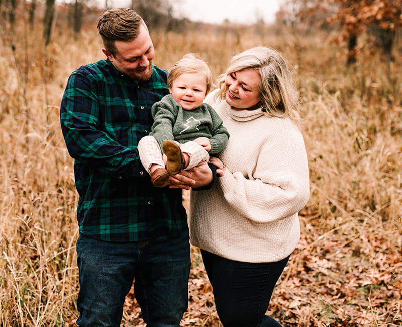 Andrew Goette (left) with his wife, Ashley, and son, Lennon. (Photo by Elle Anne Photography)