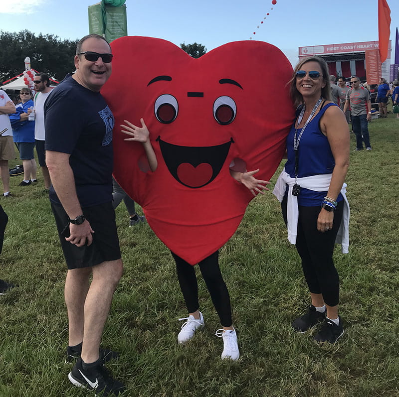 Mike and Heather Lister with daughter Emmi (in costume) at an American Heart Association event.