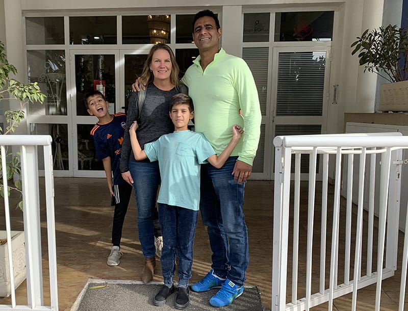 Alec Ahmad (left) with his brother Abel and parents Angela and Kamran in 2019. (Photo courtesy of Angela Grinstead Ahmad)