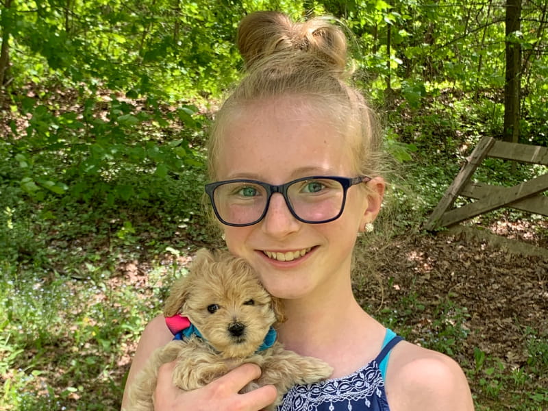 Heart disease survivor Abrielle Tallquist with the family's puppy, Liberty. (Photo courtesy of the Tallquist family)