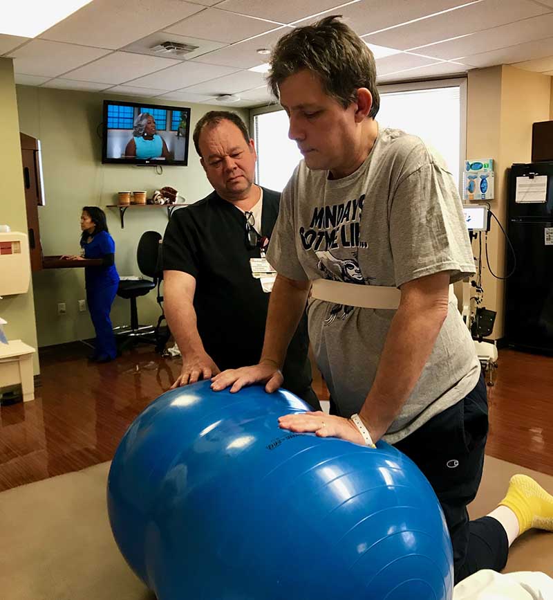 Mark Davis working with his physical therapist, Dave Collins. (Photo courtesy of Mark Davis)