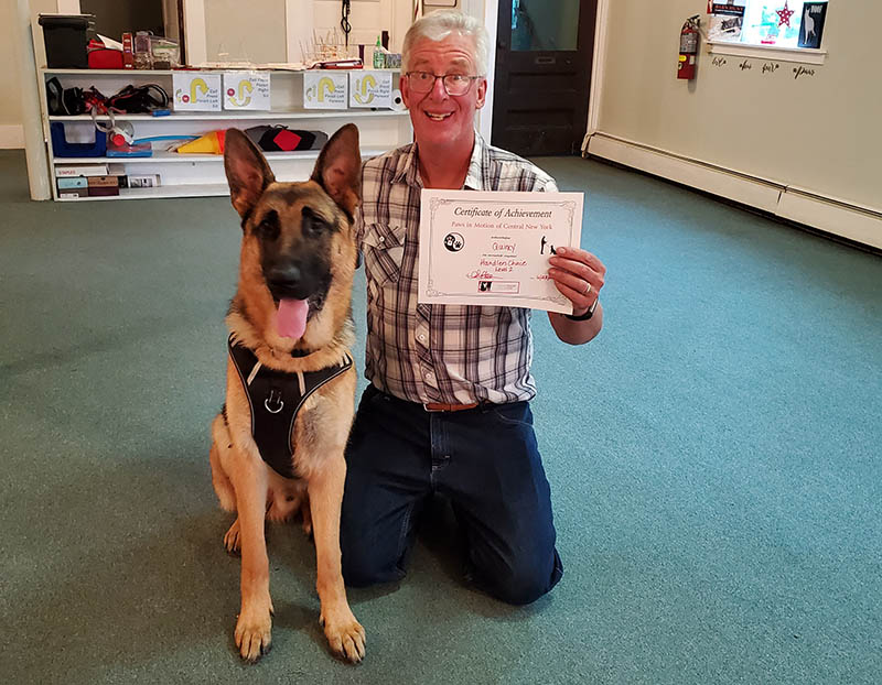Dan Wiles with his dog, Quincy, at obedience training. (Photo courtesy of Lisa Wiles)