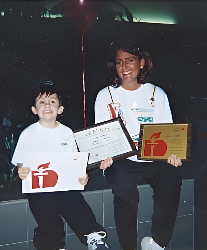 Bryce Cornet as a child (left) and his mom, Kimberly, holding up American Heart Association signs. (Photo courtesy of Bryce Cornet)