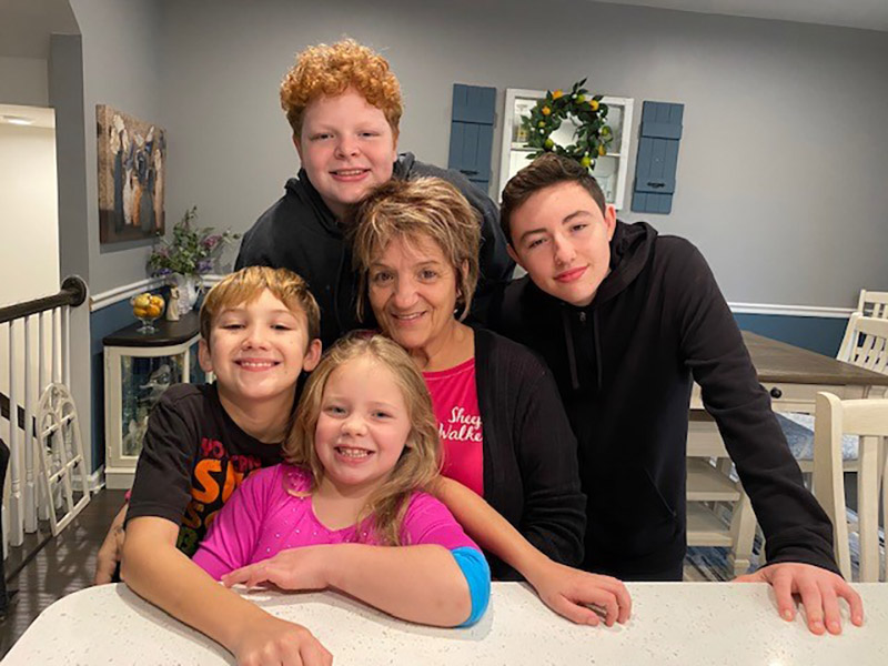 Katherine Romano surrounded by her grandchildren a week after her heart attack, clockwise from bottom: Kayla, Hank, Kody and Ian. (Photo courtesy of Kristen Emery)