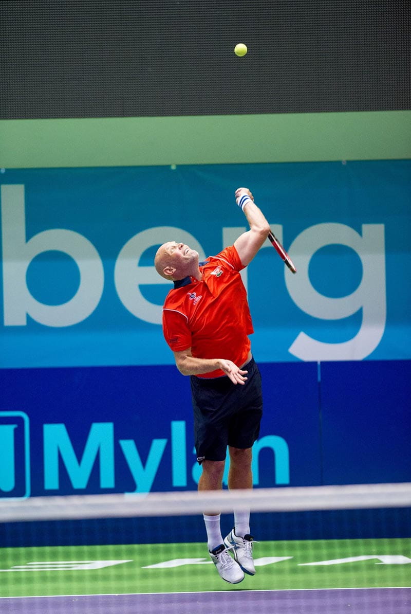 Murphy Jensen serving for the Washington Kastles, the team he coached to 34 straight victories –  a record across all pro sports. (Photo courtesy Rich Kessler)