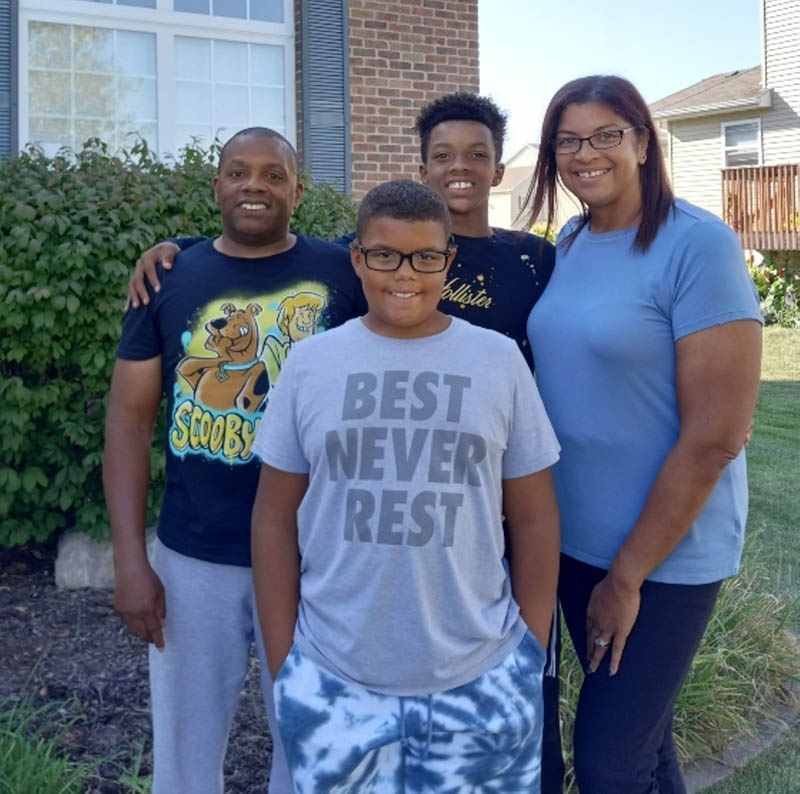 Brady Johnson (left) with his wife, Heather, and their sons, Ben and Brayden. (Photo courtesy of the Johnson family)