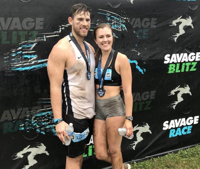 Though Olivia Copeland has Long QT Syndrome and a defibrillator, she still competes in mud runs, finishing a recent race with her boyfriend Jason. (Photo courtesy of Barbara Jackson)