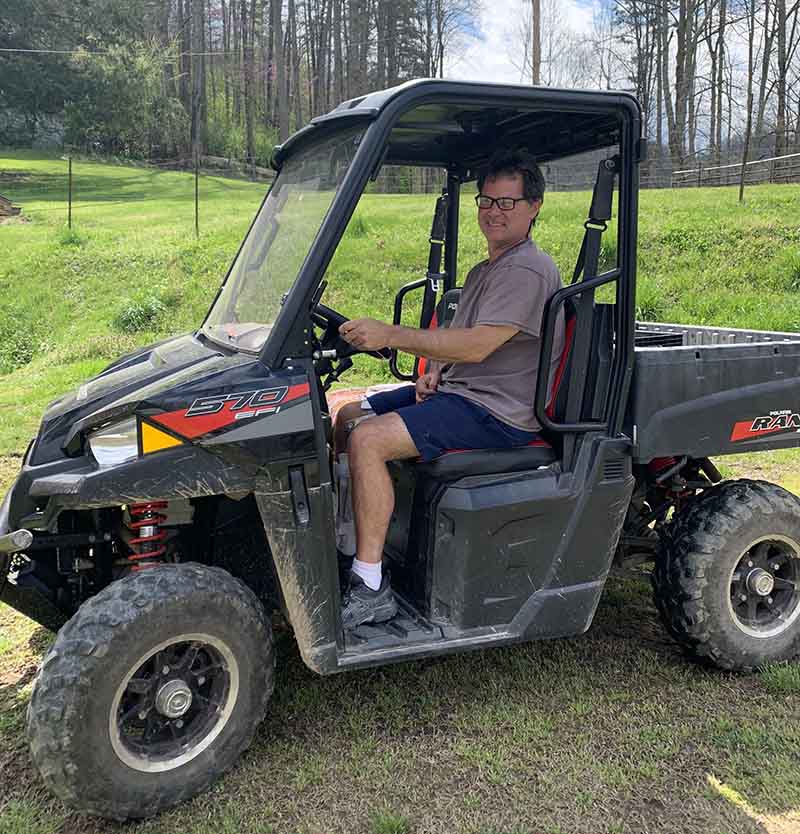 Mark Kincaid enjoys driving an all-terrain vehicle in his rural area of eastern Kentucky. (Photo courtesy of Tonya Kincaid)