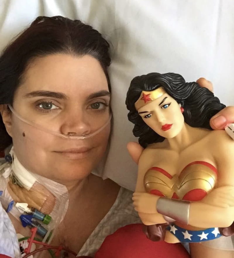 Stacy Beckly recovering after her open-heart surgery with a Wonder Woman action figure. (Photo courtesy of Stacy Beckly)