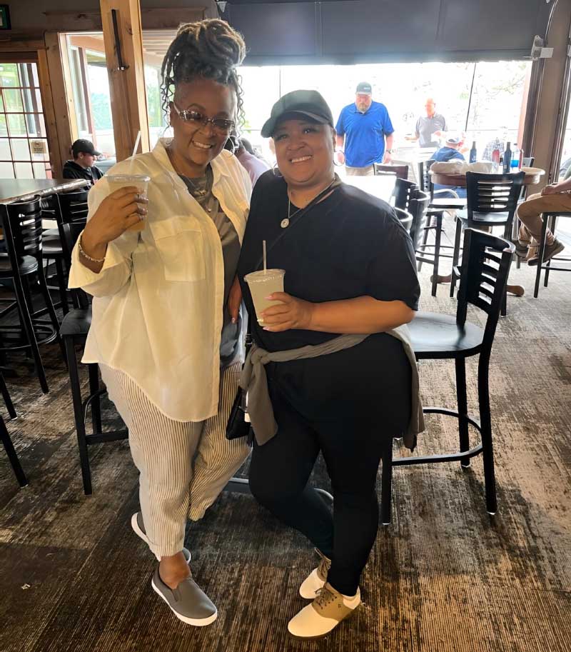 Yolanda Everette-Neufville (left) with her younger sister, Roaschel Everette-Wheeler, after playing a round of golf together. (Photo courtesy of Yolanda Everette-Neufville)