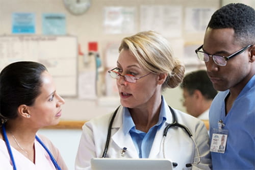 diverse team of healthcare workers conversing together