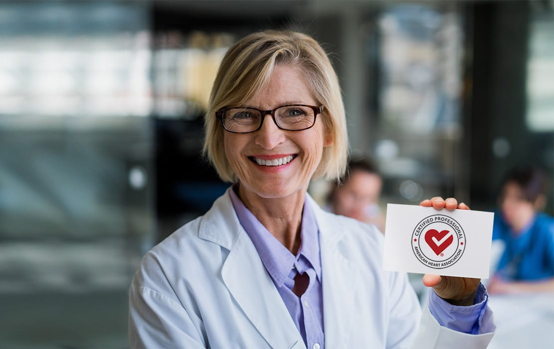 Smiling female professional holding heart check mark seal