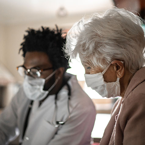 Doctor with Female Patient in Pink SNF 