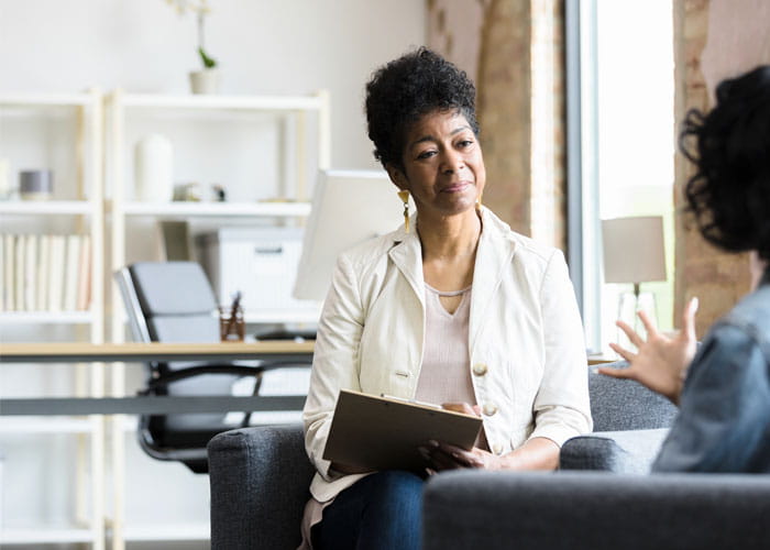 Therapist listens to patient