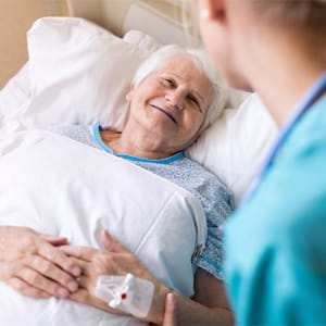 Hospital patient smiling with nurse
