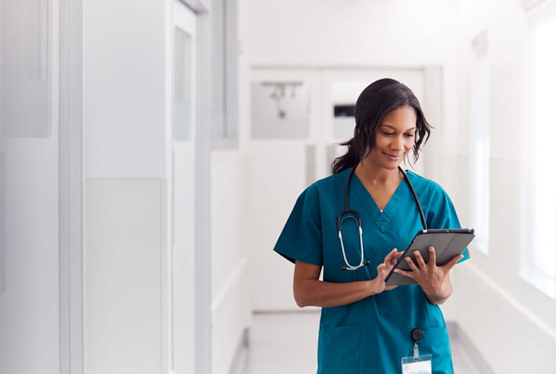 Woman medical professional using tablet