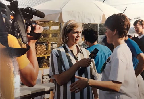 newscaster Gail Hogan interviewing