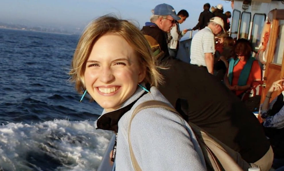 close up of smiling heart disease survivor Heather on a boat