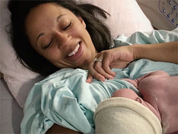 Jen Rohe, heart disease survivor with baby postpartum Jen Rohe, heart disease survivor with baby postpartum