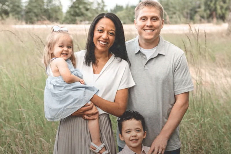 Jen Rohe and her family in an outdoor portrait
