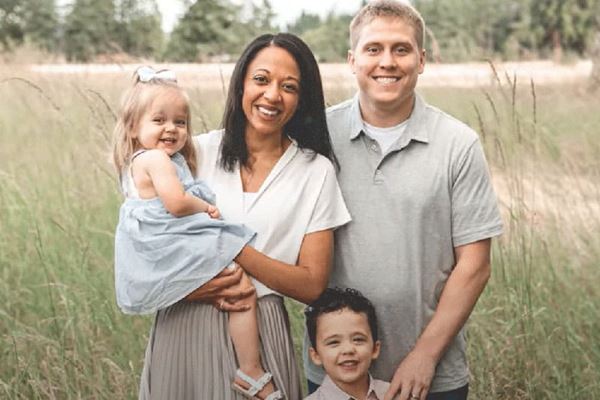 Jen Rohe and her family in an outdoor portrait Jen Rohe and her family in an outdoor portrait