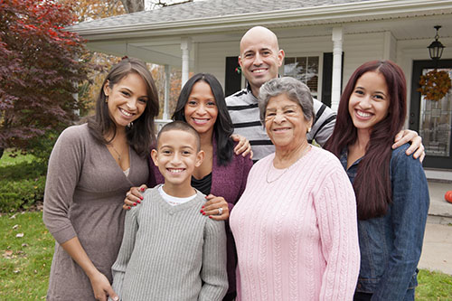 Family in front of house