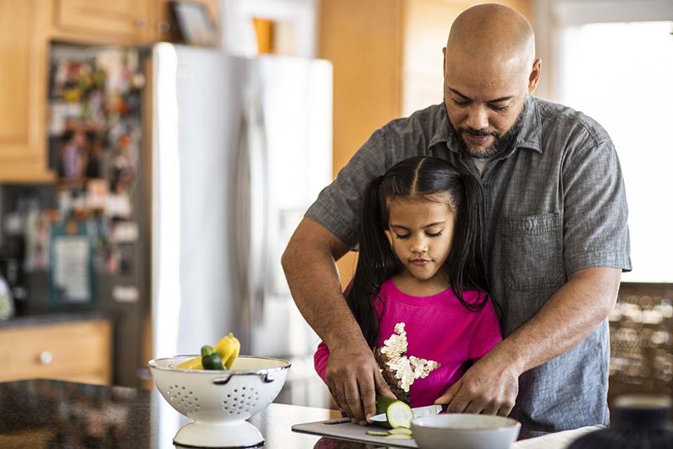 Father and daughter cooking