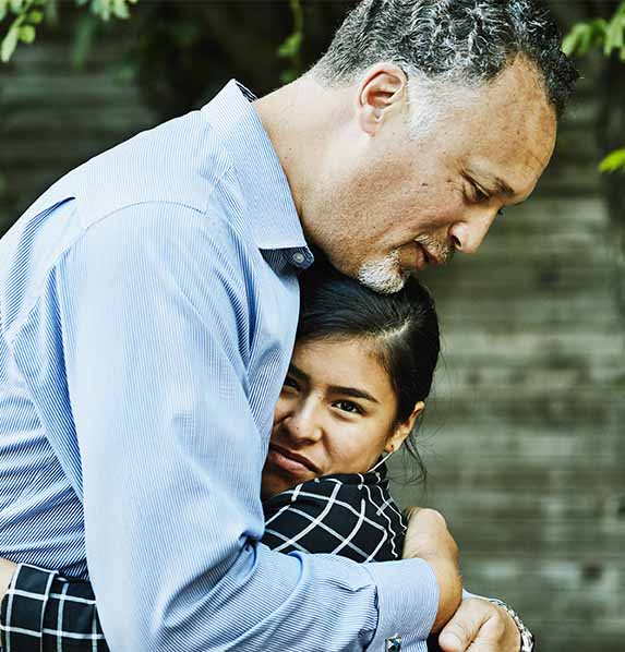 Father hugging daughter