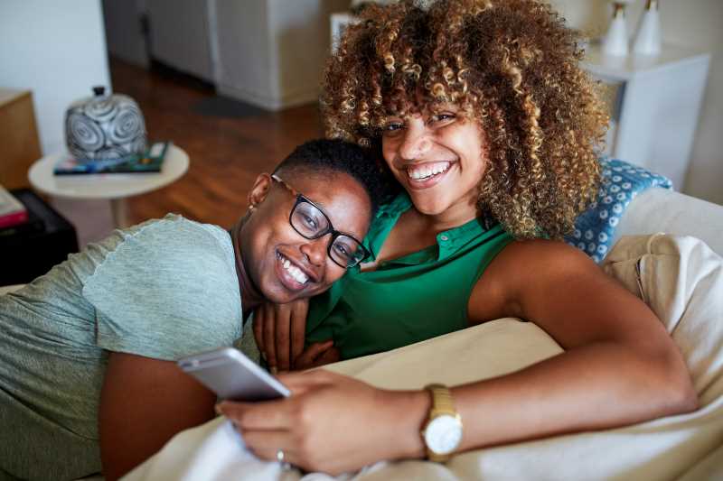 Female couple on a sofa