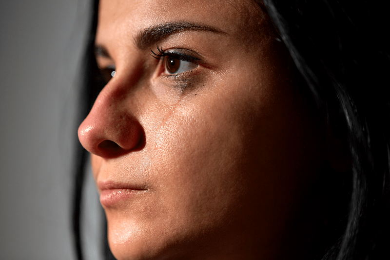close up of a woman crying