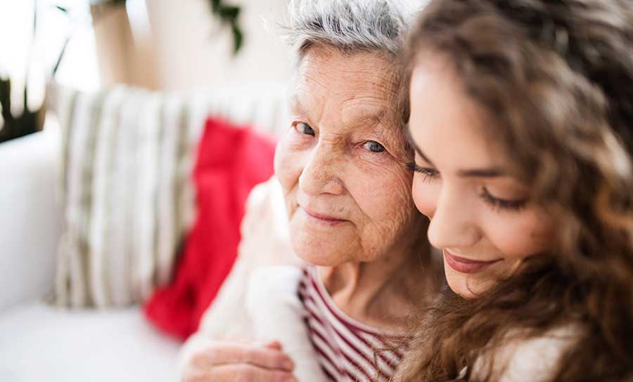 young woman hugging grandma