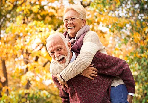 man giving woman a piggyback ride