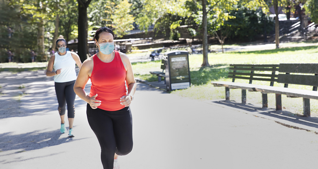 woman running outdoors wearing mask woman running outdoors wearing mask