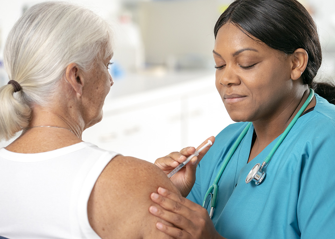 Elderly woman flu shot