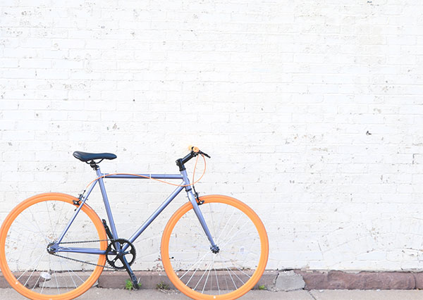 white wall with bike leaning on it