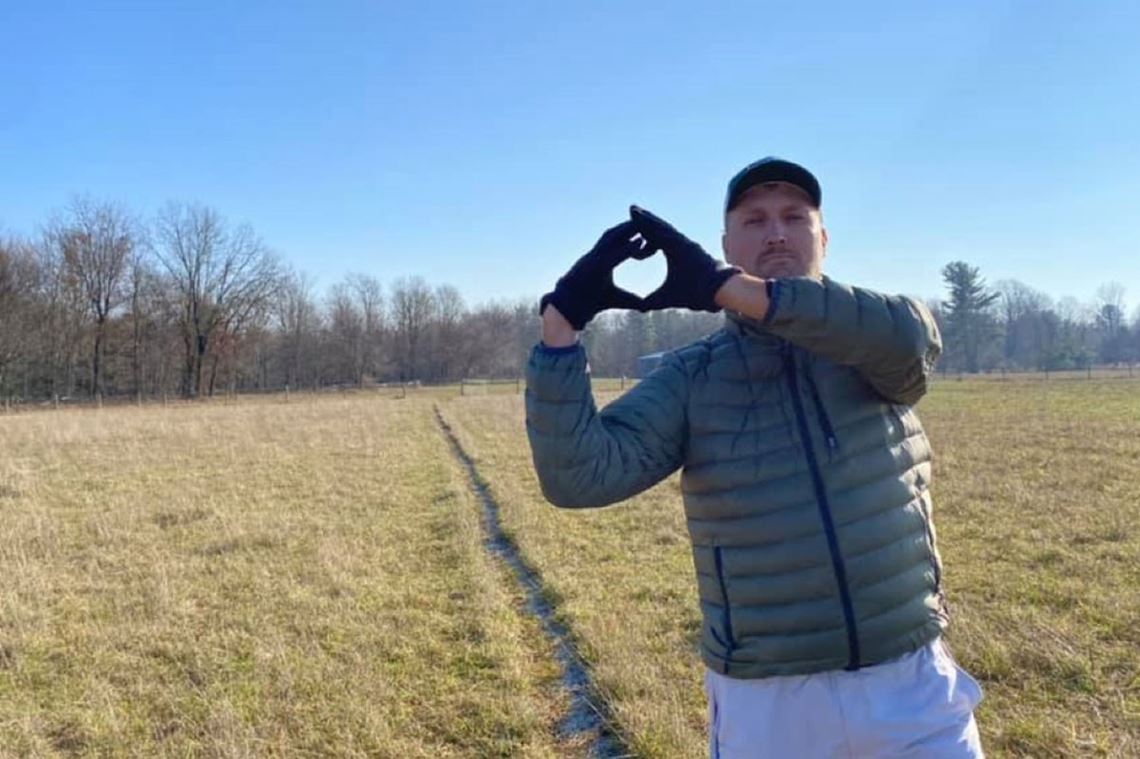 Nic Desinski holding his hands in heart shape