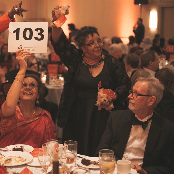 20-SE-HB-People seated at Table Bidding on Auction People seated at Table Bidding on Auction