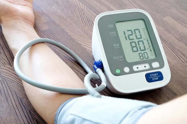 person wearing blood pressure cuff