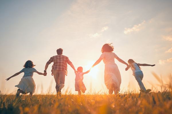 family running in a field