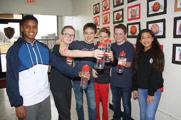 Northwest Arkansas Kids holding water bottles