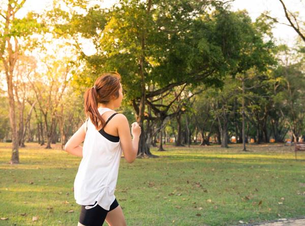 a woman who is a Changemaker jogging in the park