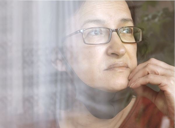 Don't Die of Doubt Woman looking out a window
